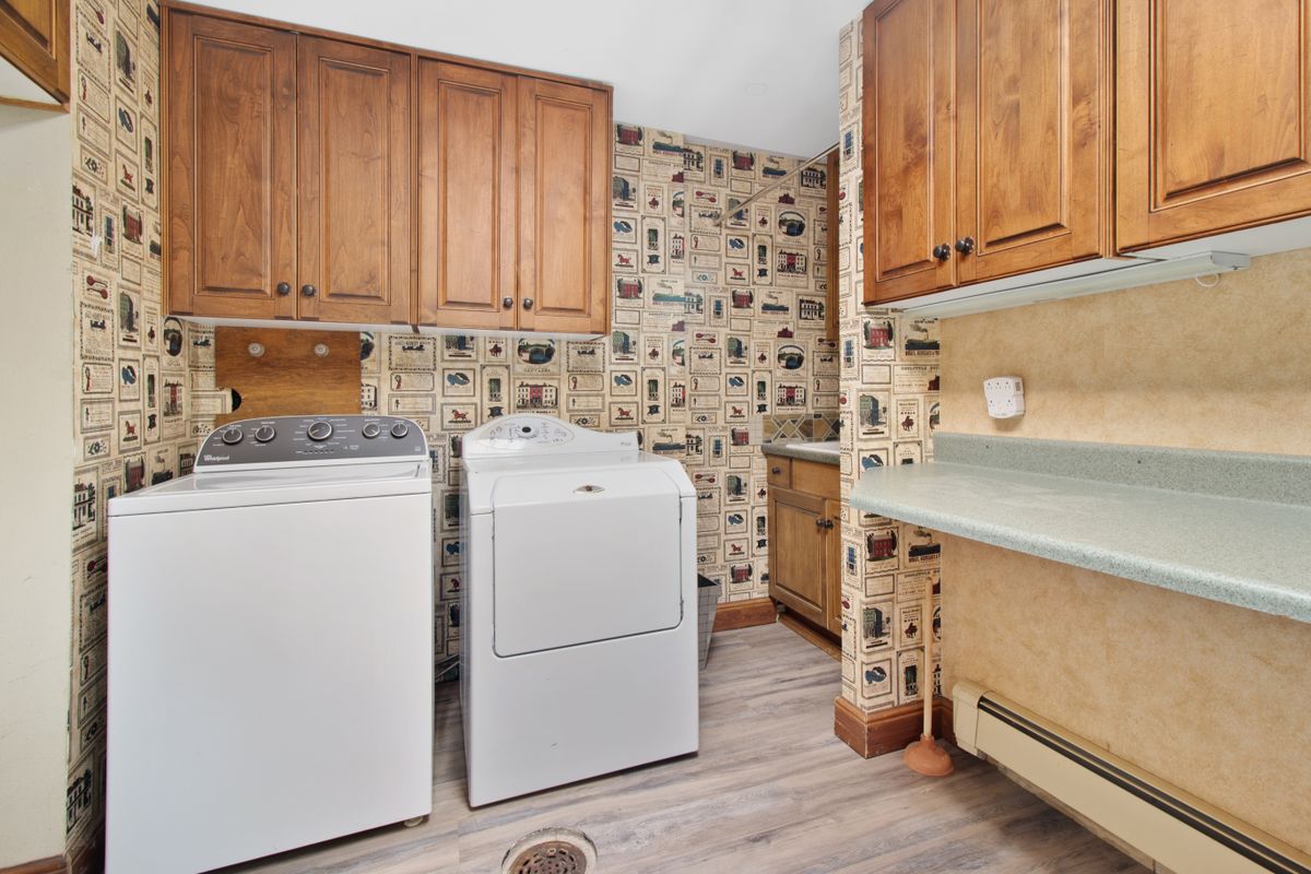 Washer and dryer awaiting appliance removal