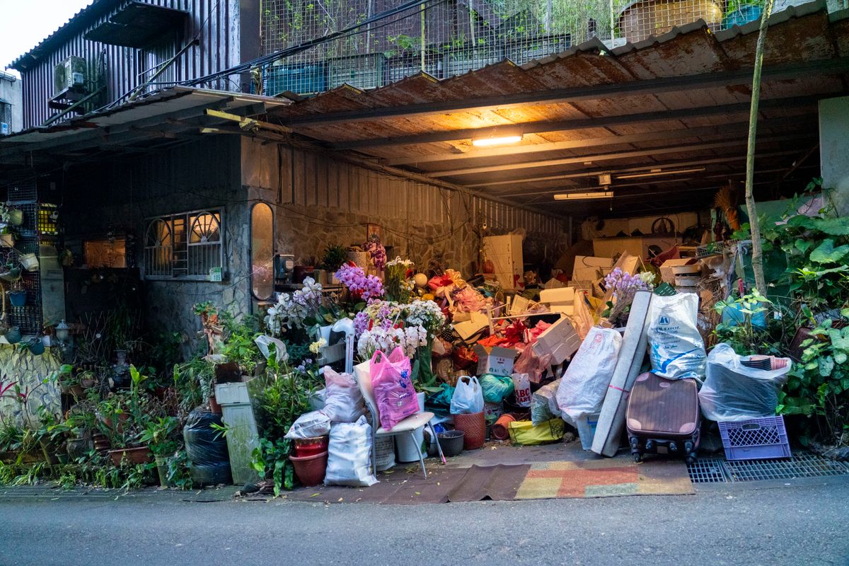 Cluttered garage packed with household items before a professional garage cleanout